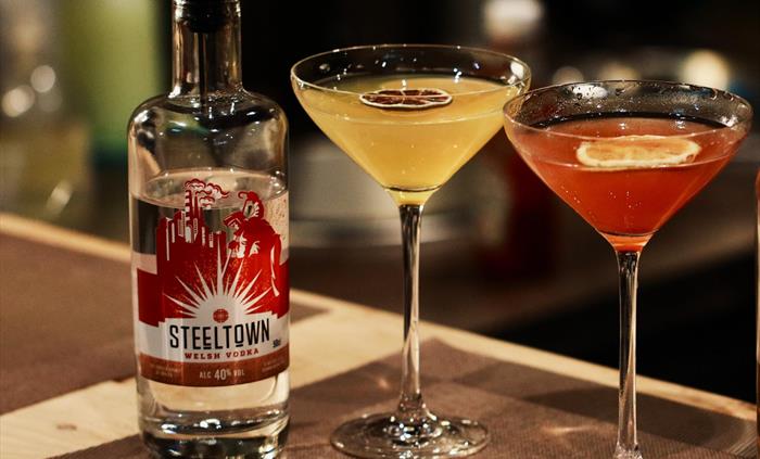 Steeltown Welsh Vodka Cocktails in Martini glasses on the bar at the Spirit of Wales Distillery